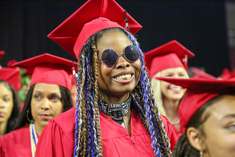 Graduating student from Rangeview High School smiles for the camera.