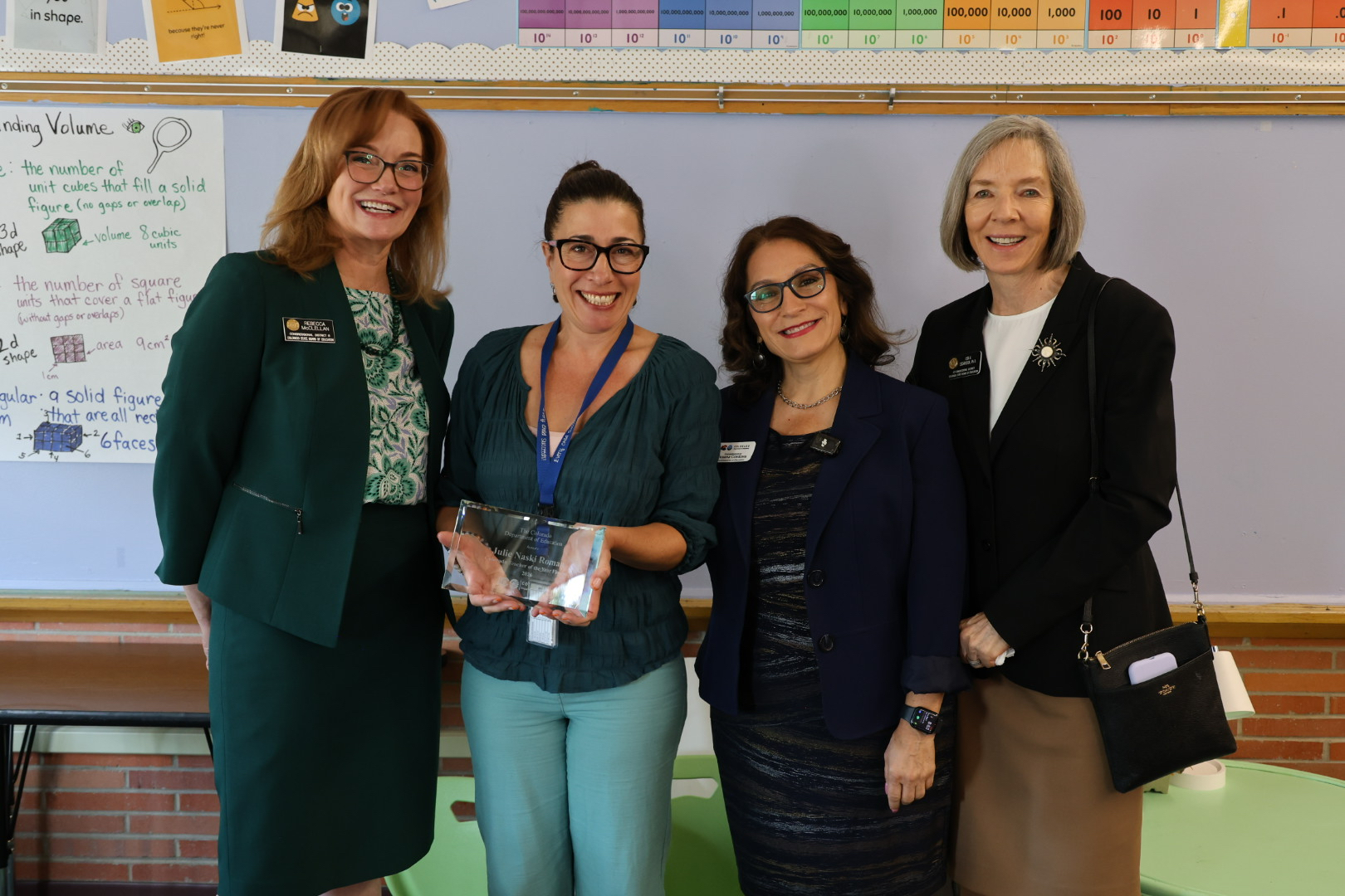 Teacher of the Year Finalist 2026 Julie Naski Roman poses with State Board of Education Chair Rebecca McClellan, Colorado Education Commissioner Susana Córdova and State Board Member Lisa A. Escárcega. 