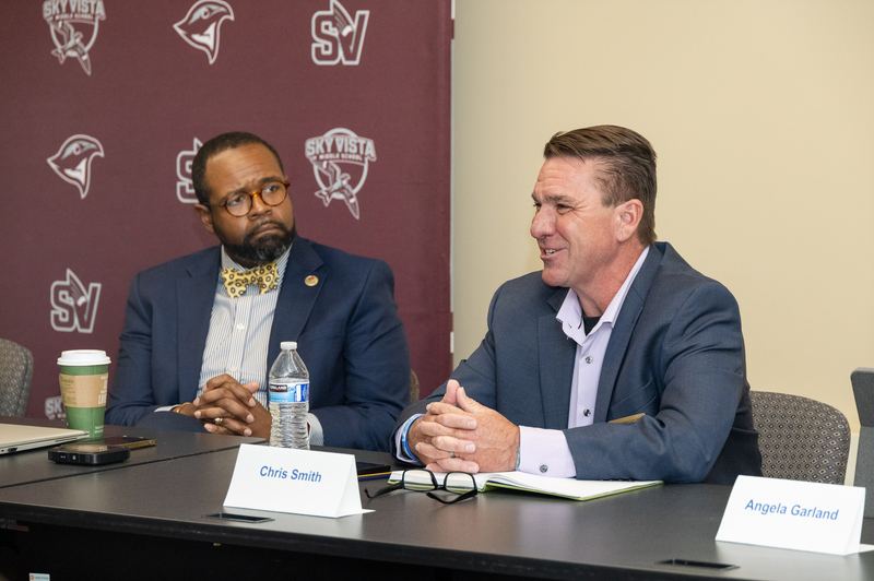Mordecai Brownlee, President of the Community College of Aurora, looks at Cherry Creek School District Superintendent Chris Smith as he speaks. 